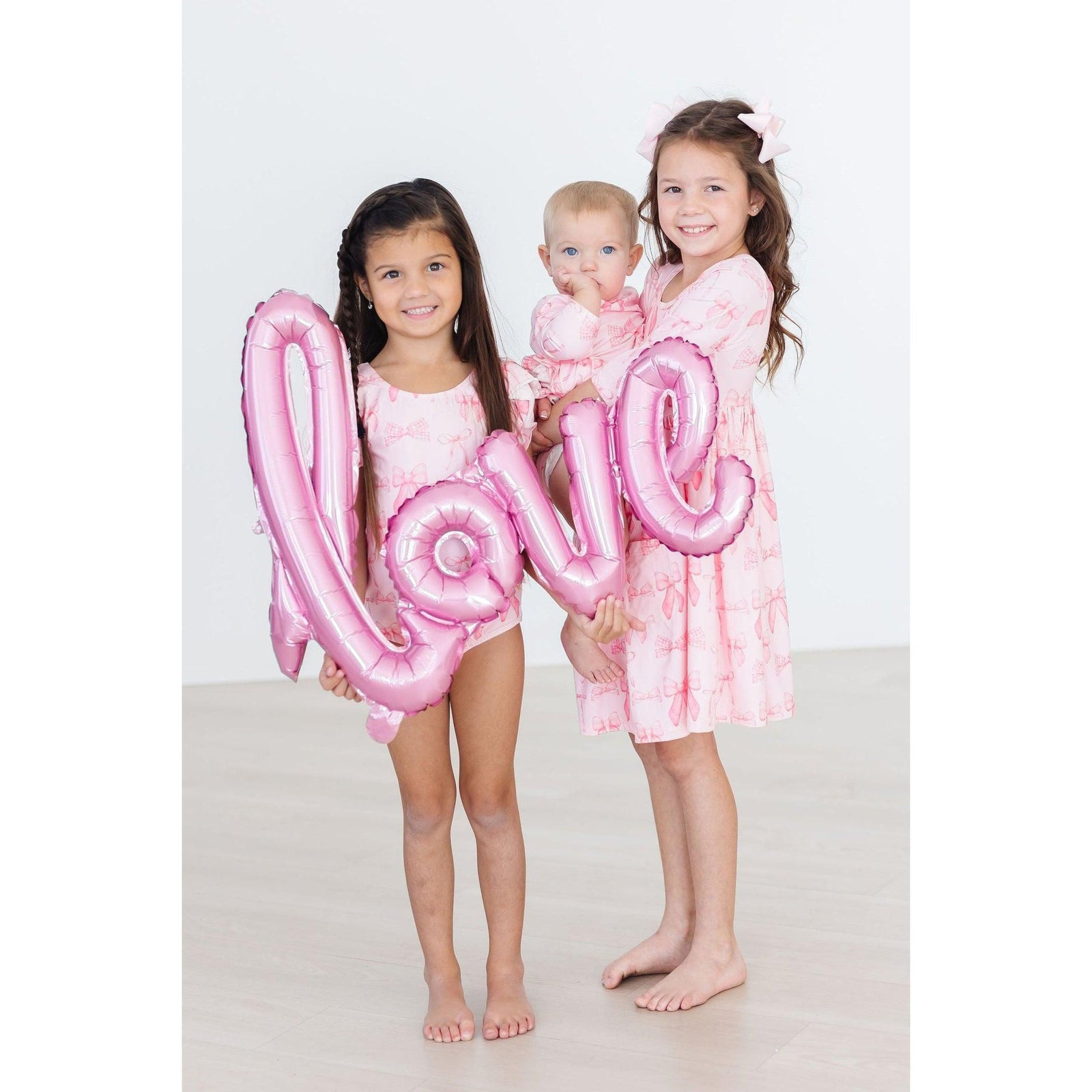 Blushing Bows 3/4 Sleeve Twirl Bodysuit