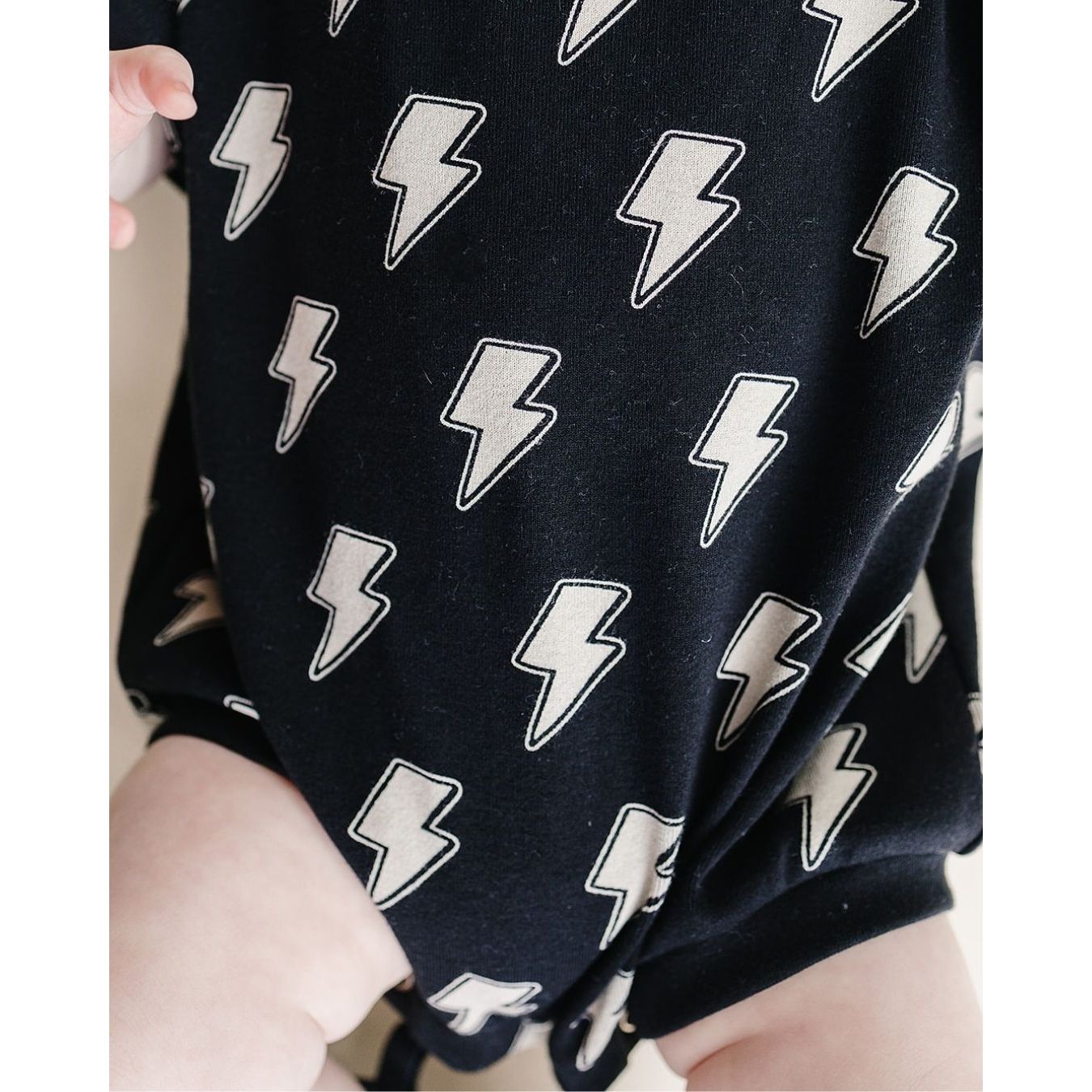 Short Sleeve Bubble Romper | Black Bolts