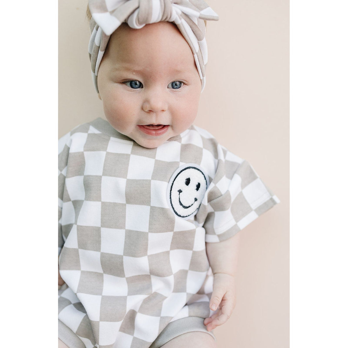 Short Sleeve Bubble Romper | Checkered Smiley Latte