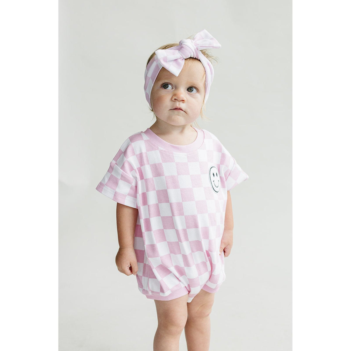 Short Sleeve Bubble Romper | Checkered Smiley Pink