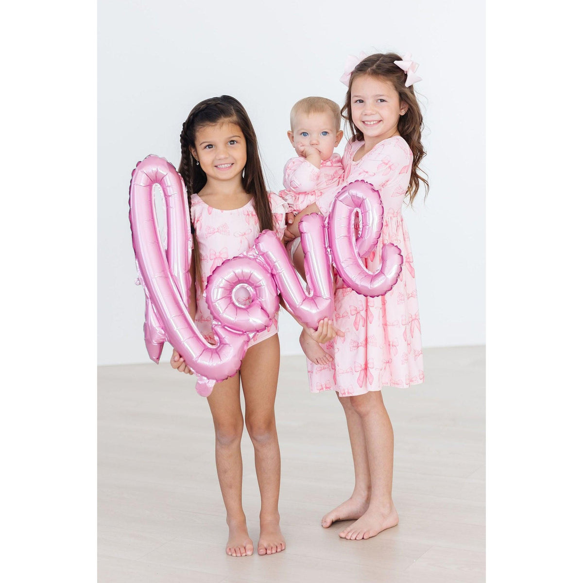 Blushing Bows 3/4 Sleeve Twirl Bodysuit