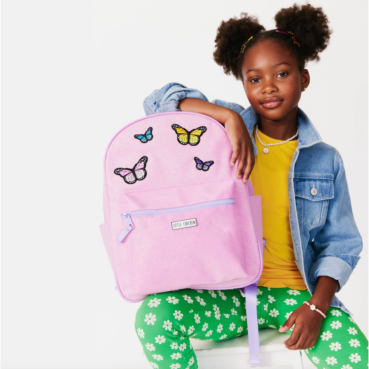pink glitter backpack with patches
