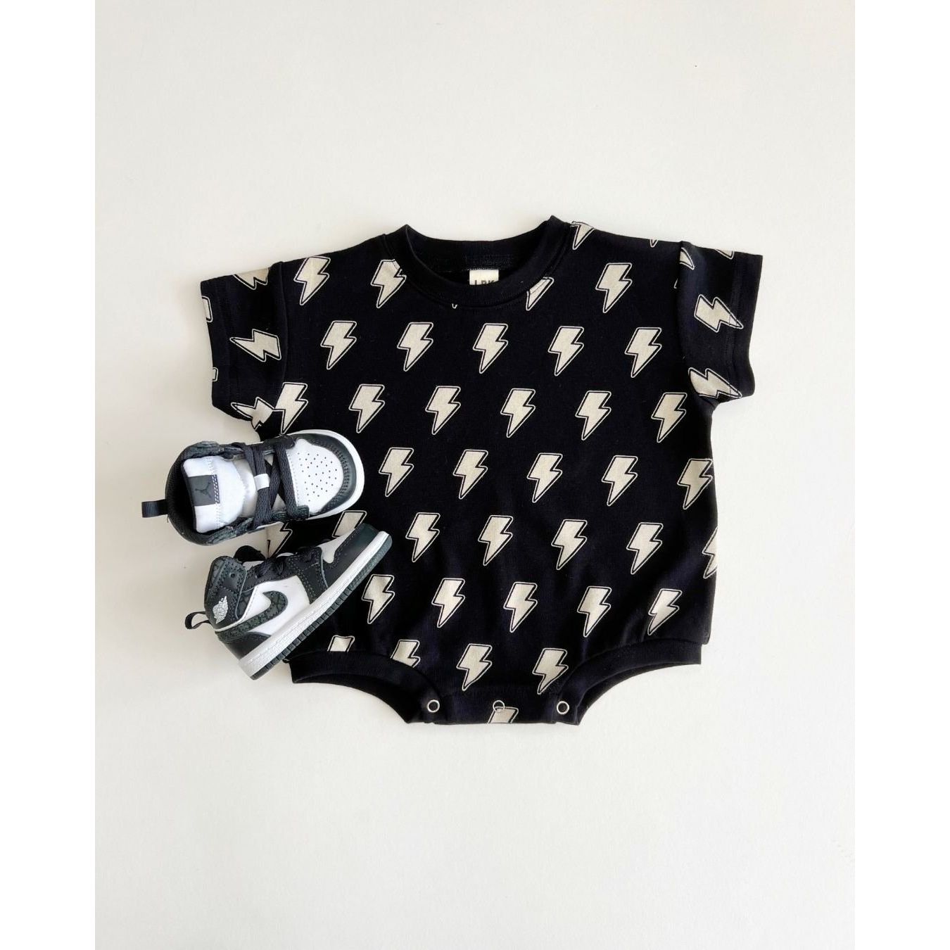 Short Sleeve Bubble Romper | Black Bolts