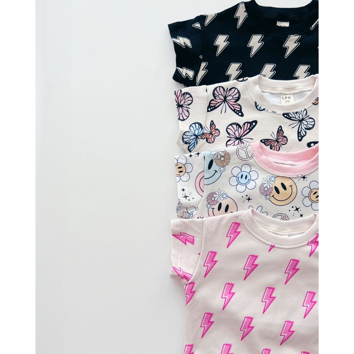 Short Sleeve Bubble Romper | Black Bolts