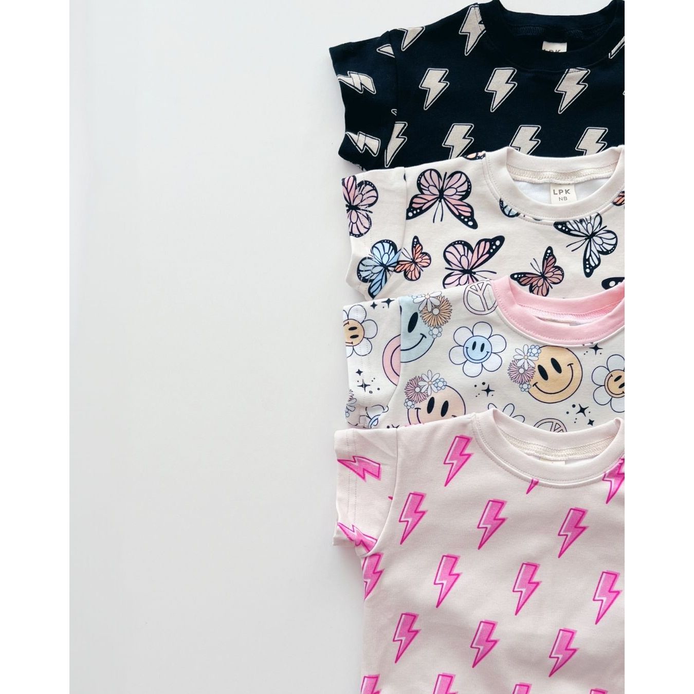 Short Sleeve Bubble Romper | Black Bolts