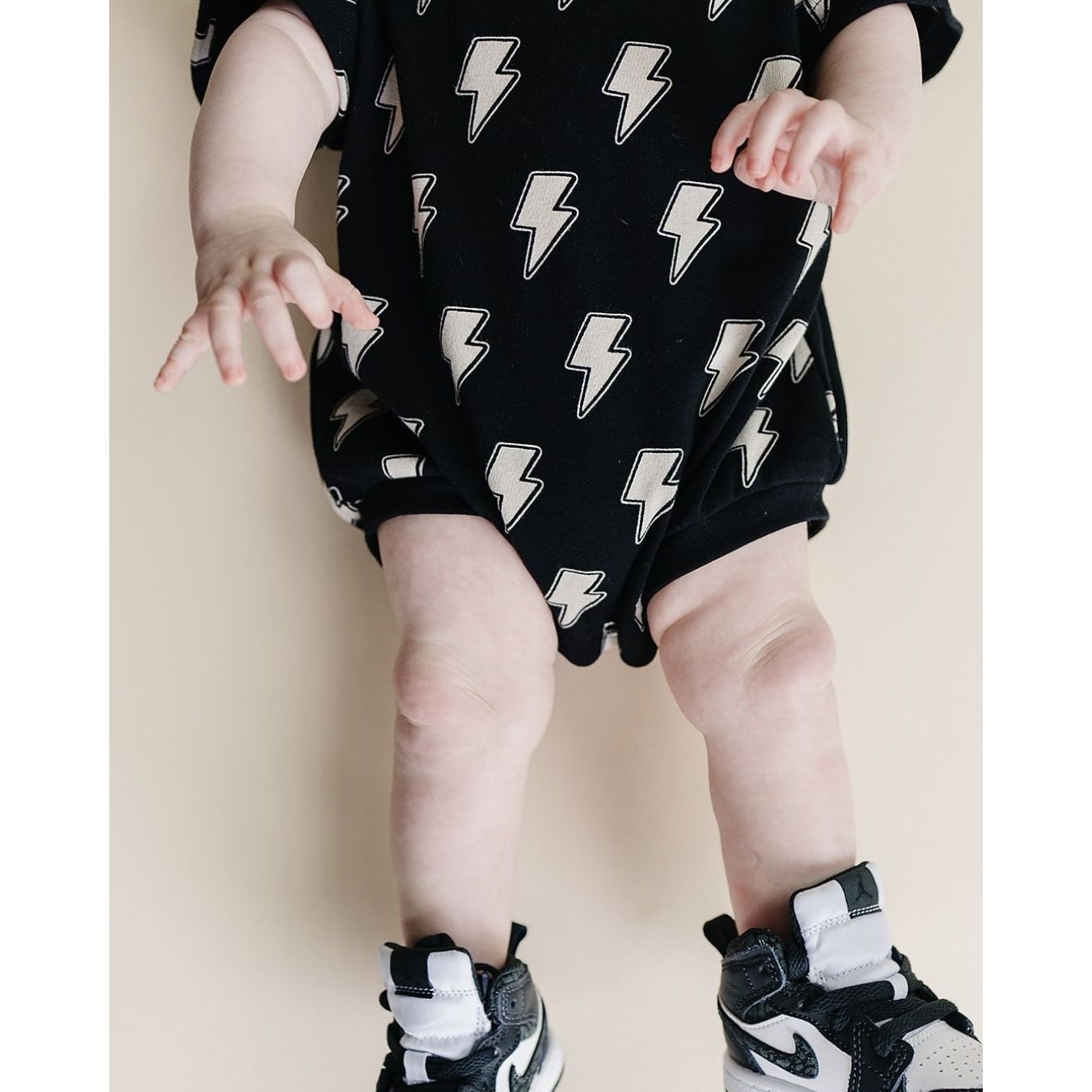 Short Sleeve Bubble Romper | Black Bolts
