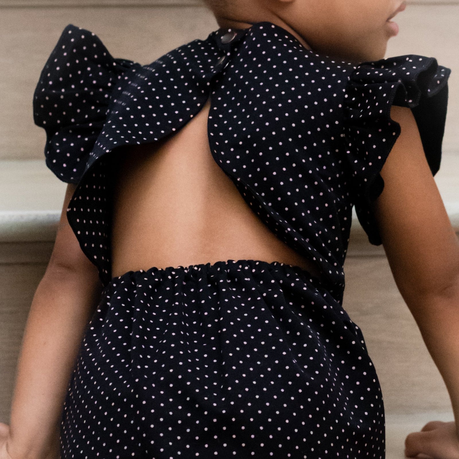 scarlet romper in black with pink dot