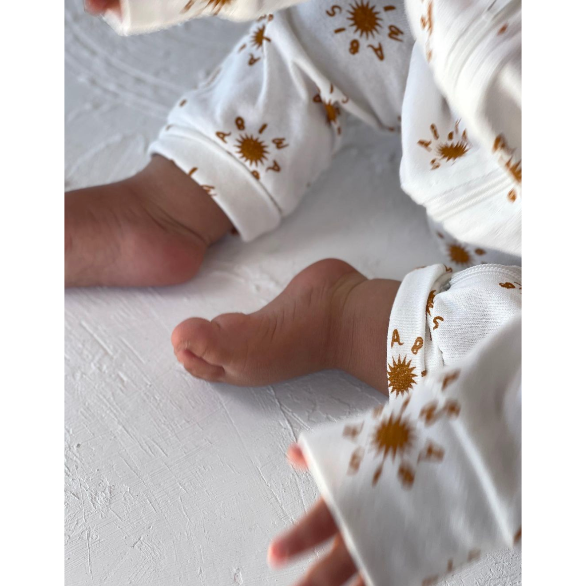 wasabi sun ziggy zip onesie in rust