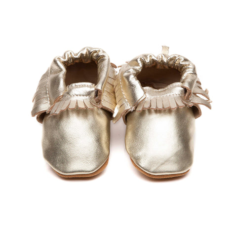 baby moccasins in gold