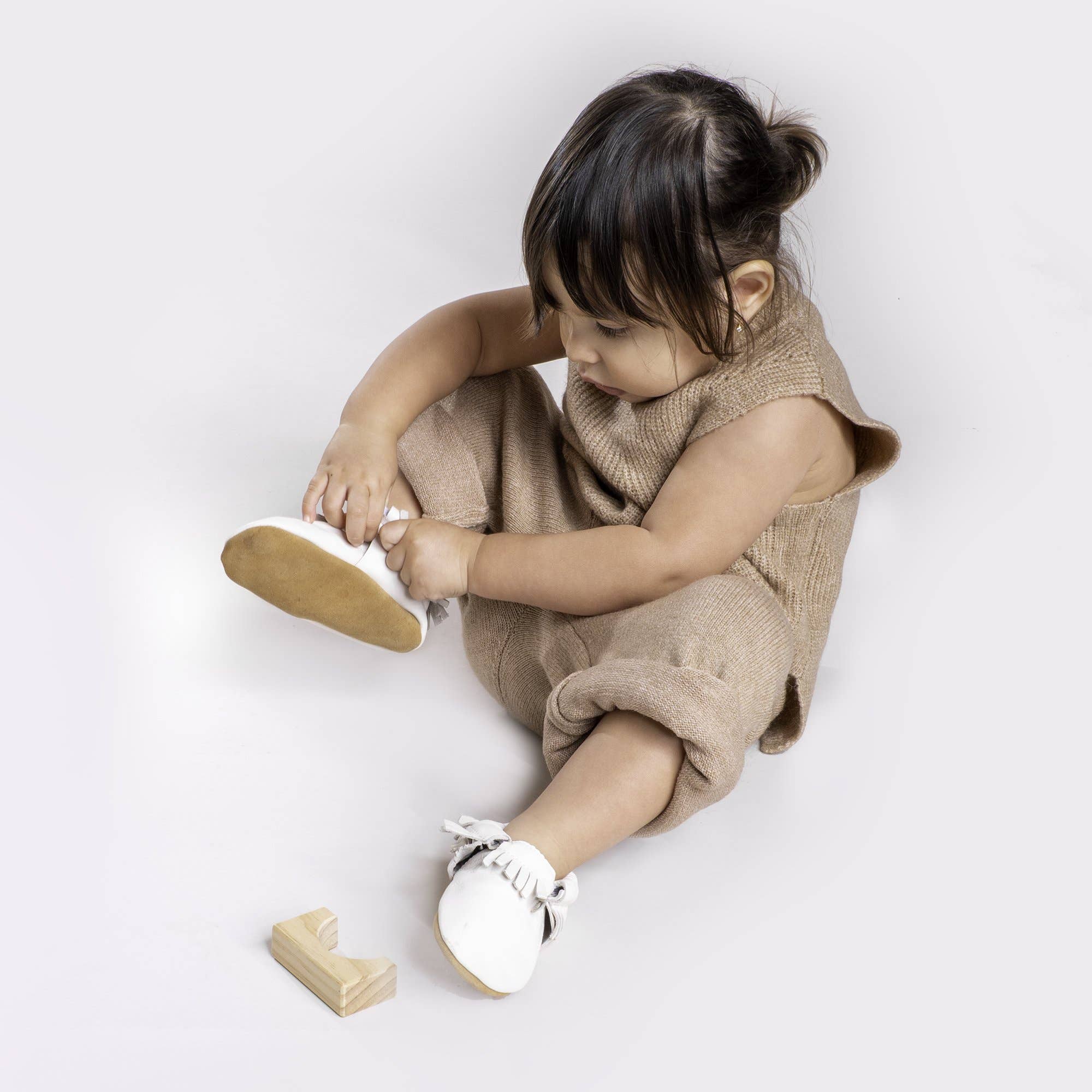 baby moccasins in white