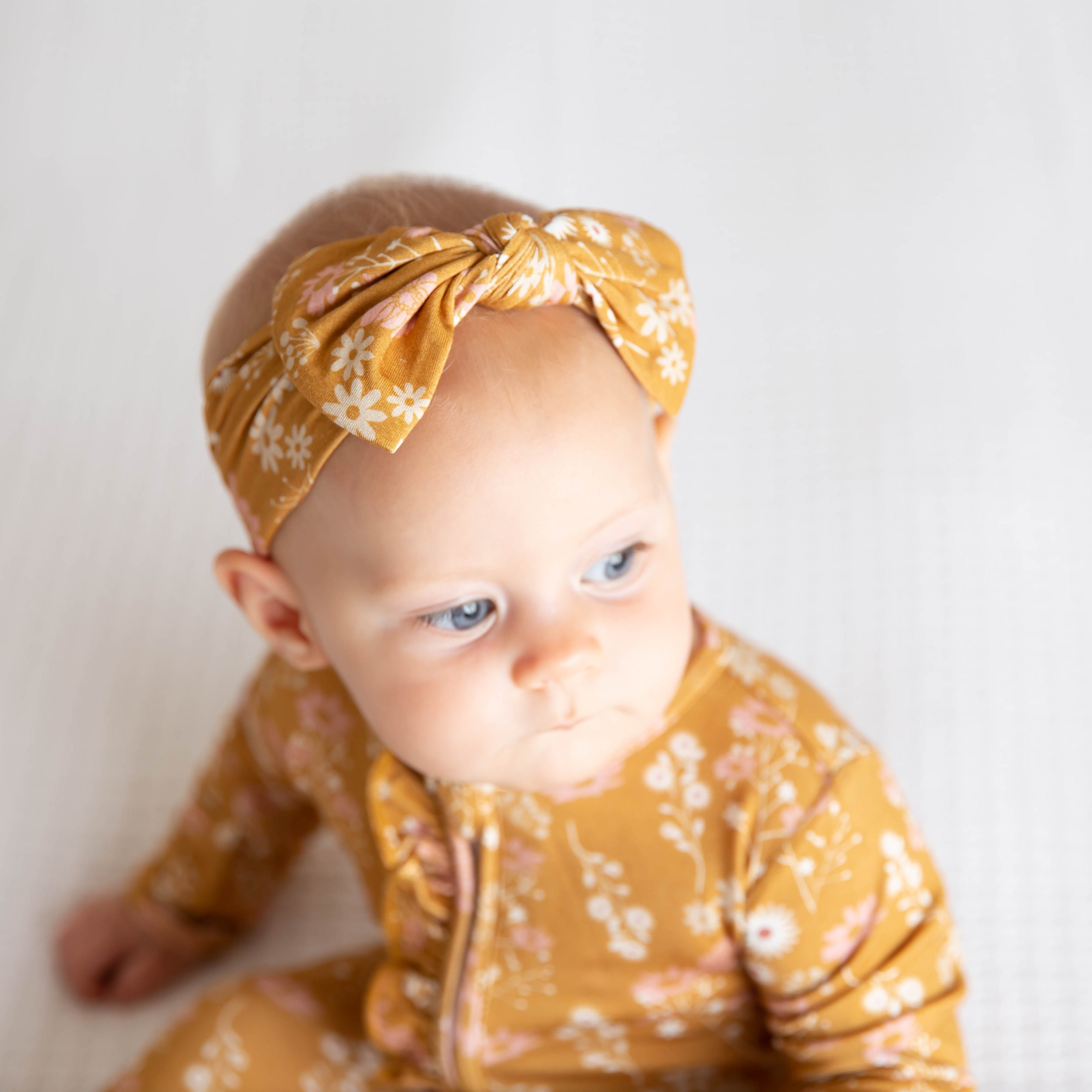 bamboo baby pajamas in mustard floral