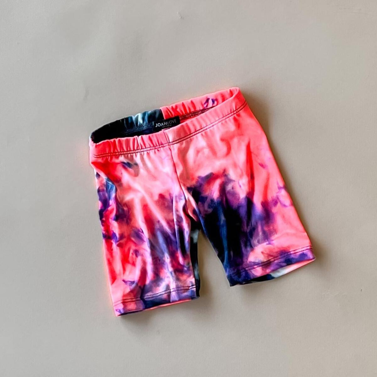 biker short in sunset neon tie dye