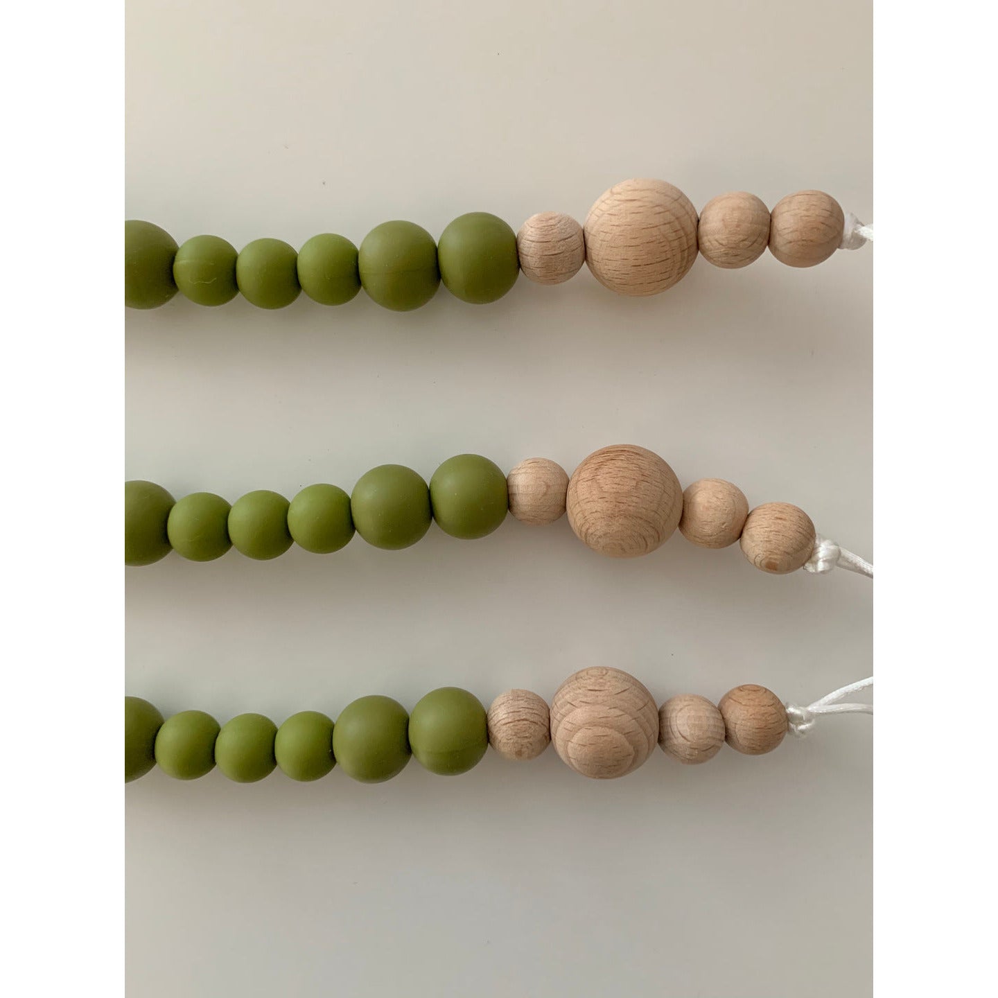carolyn pacifier clip in olive