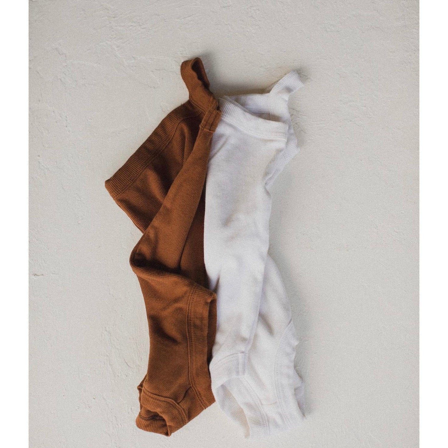 raised by water x shop kai blue one strap body suit | white
