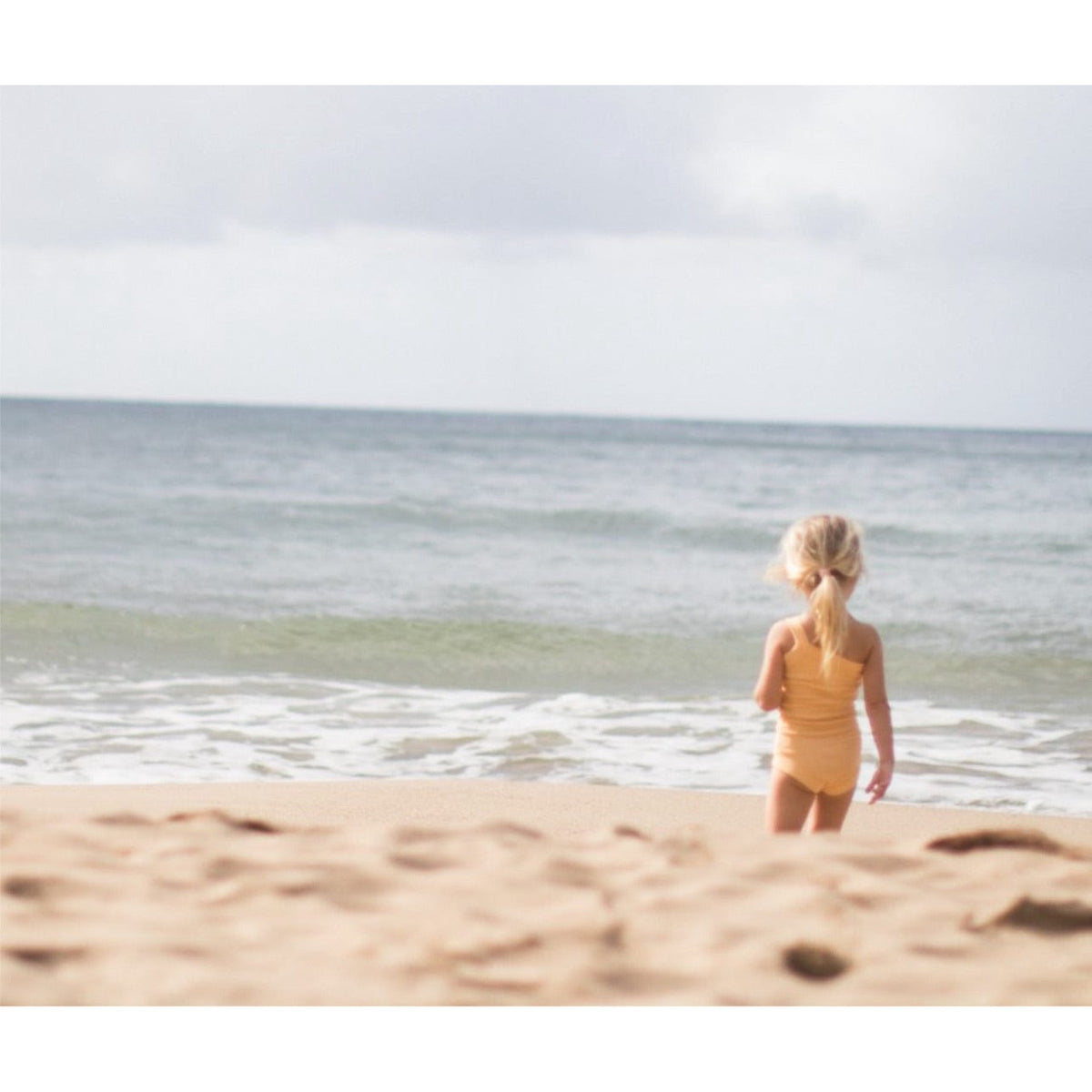 raised by water x shop kai blue one strap body suit | peach