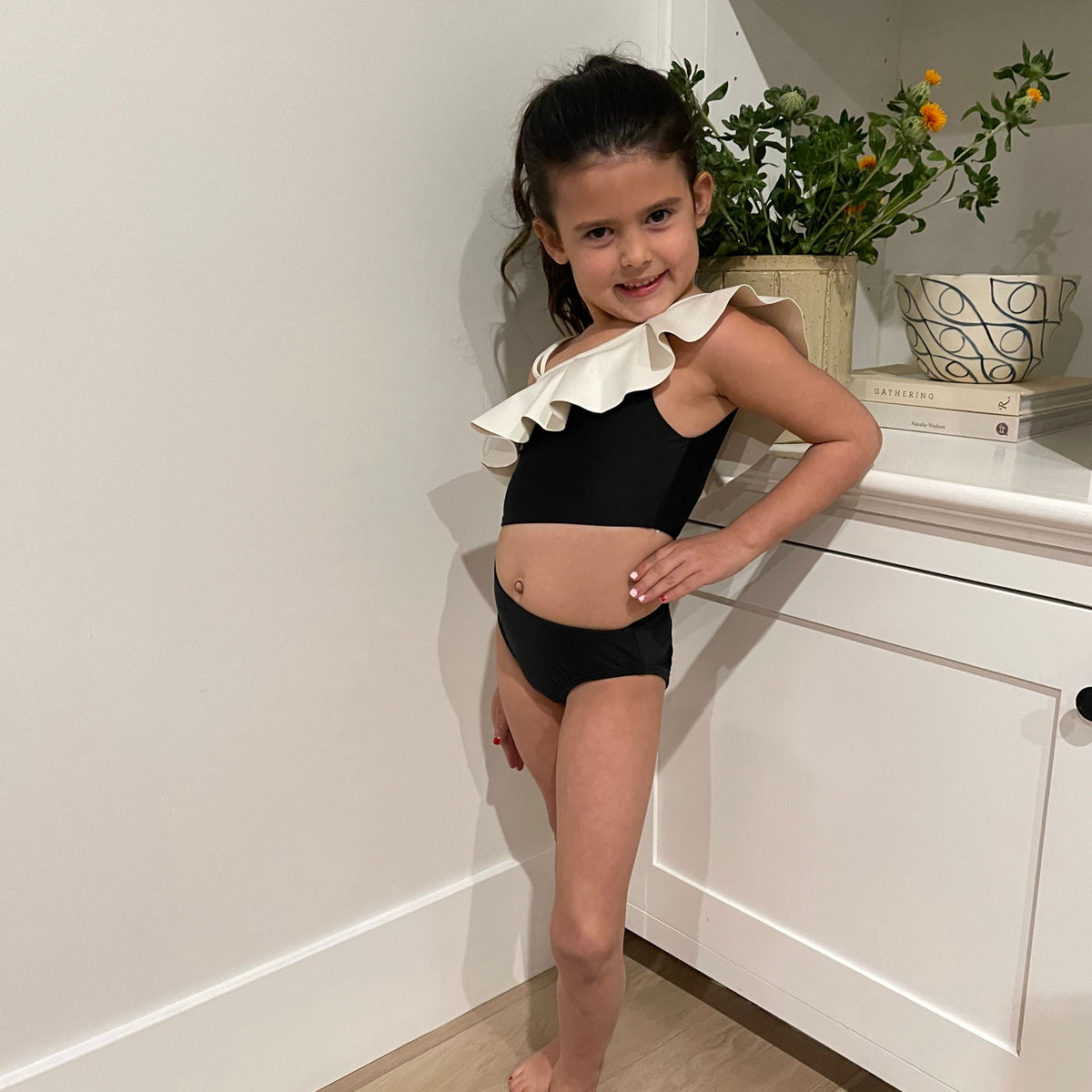 black ruffle one piece suit