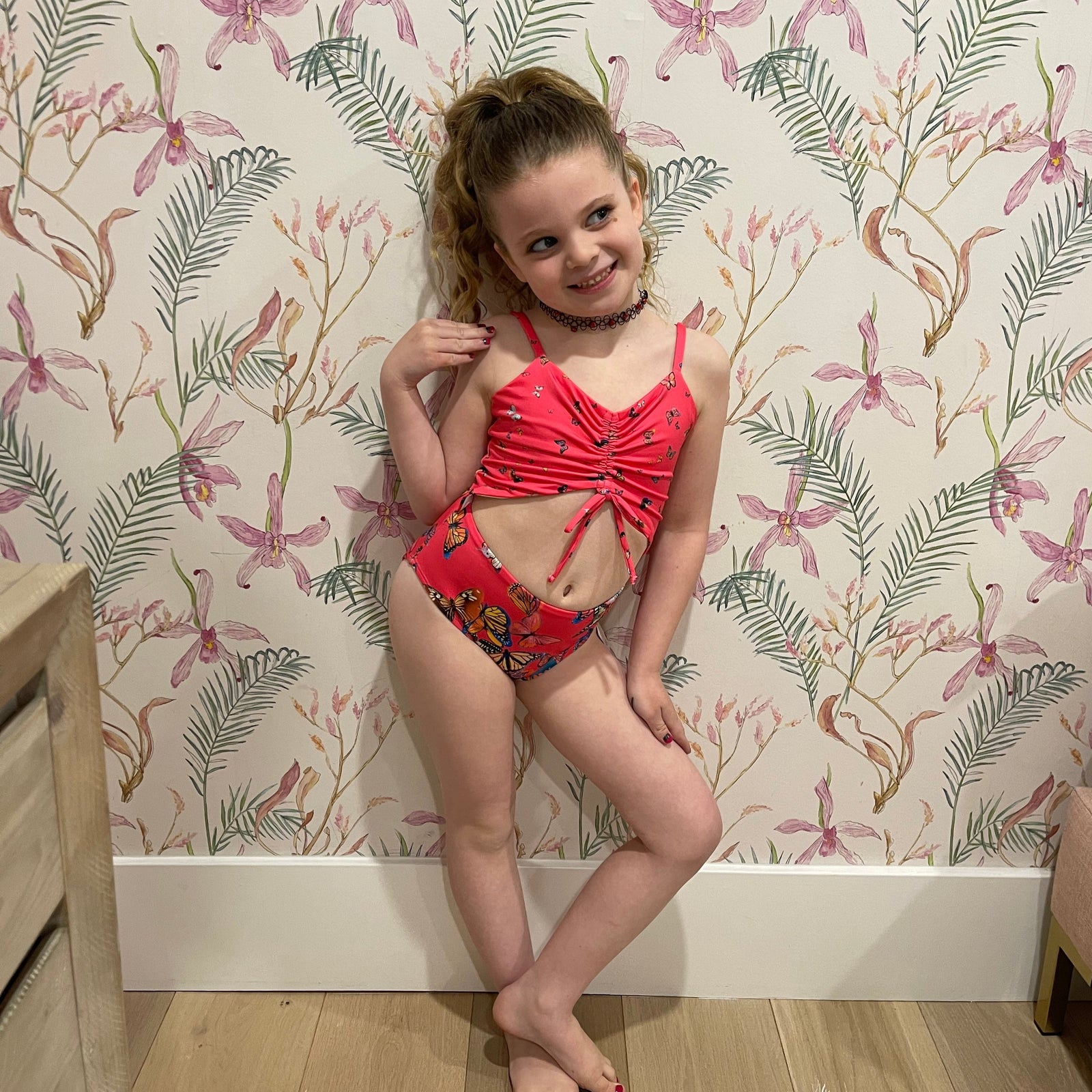 peek-a-boo suit in pink butterfly