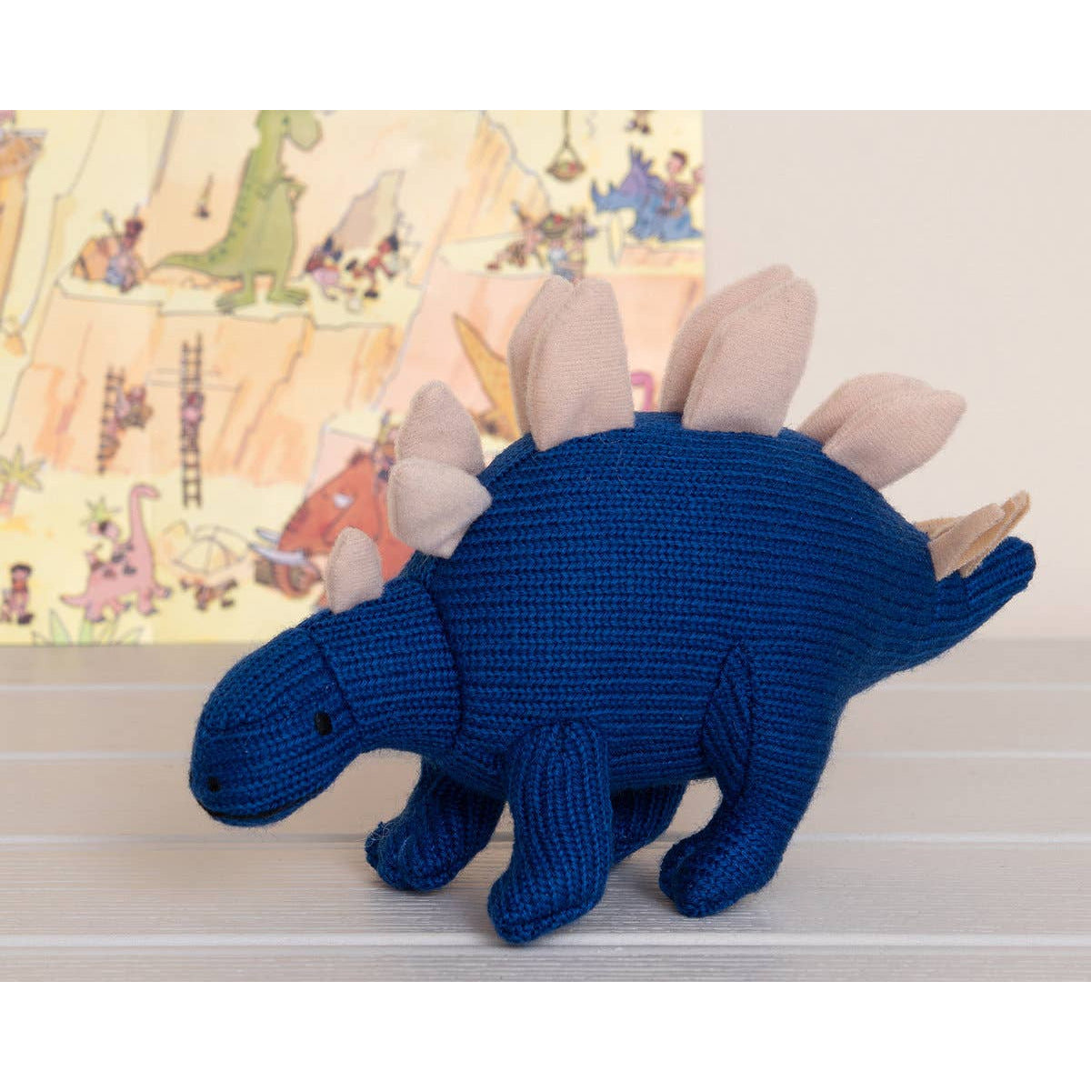 knitted blue stegosaurus baby rattle