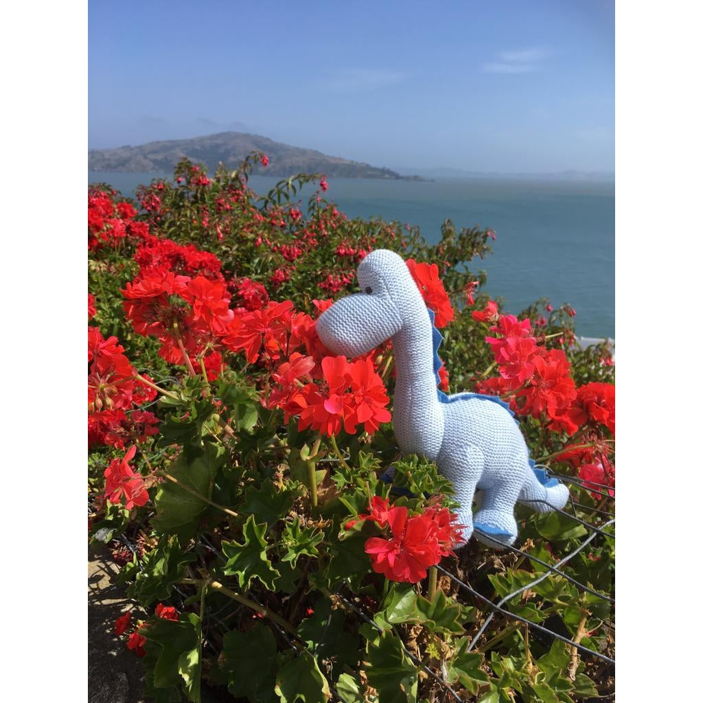 knitted organic cotton blue diplodocus dinosaur baby rattle