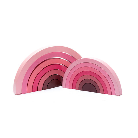 large wood rainbow puzzle toy in shades of pink