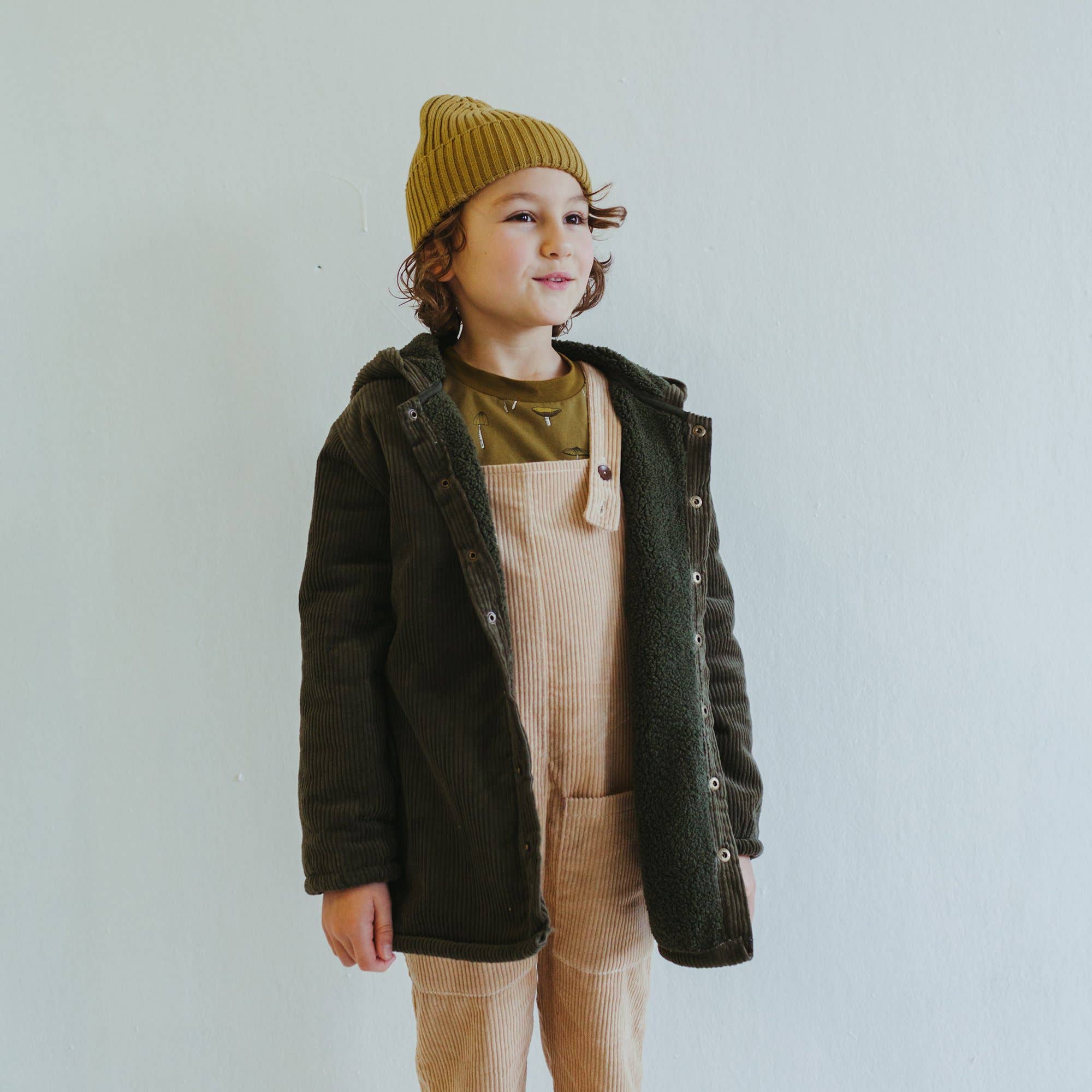 organic corduroy parka in forest