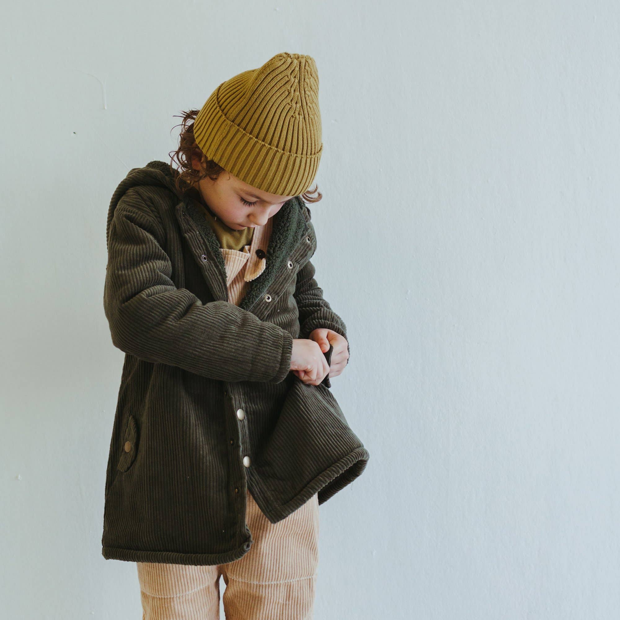 organic corduroy parka in forest
