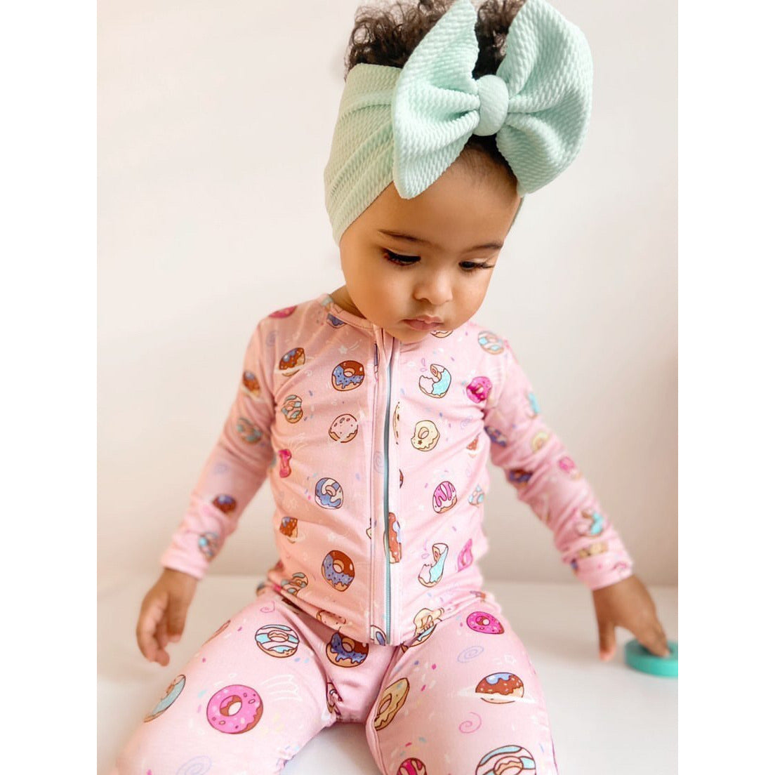 pink donut convertible footie pajamas in pink