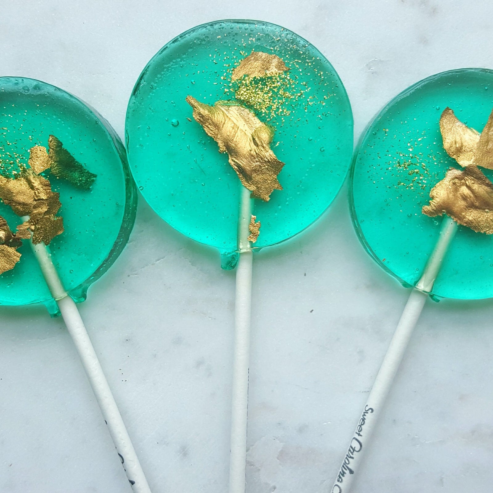 teal and gold sparkle lollipop