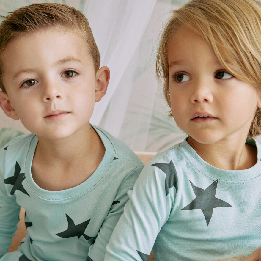 zanzibar green + black star zipper romper